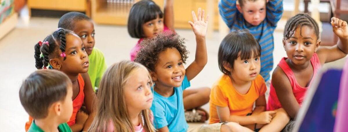 A diverse classroom of young children engaged in learning